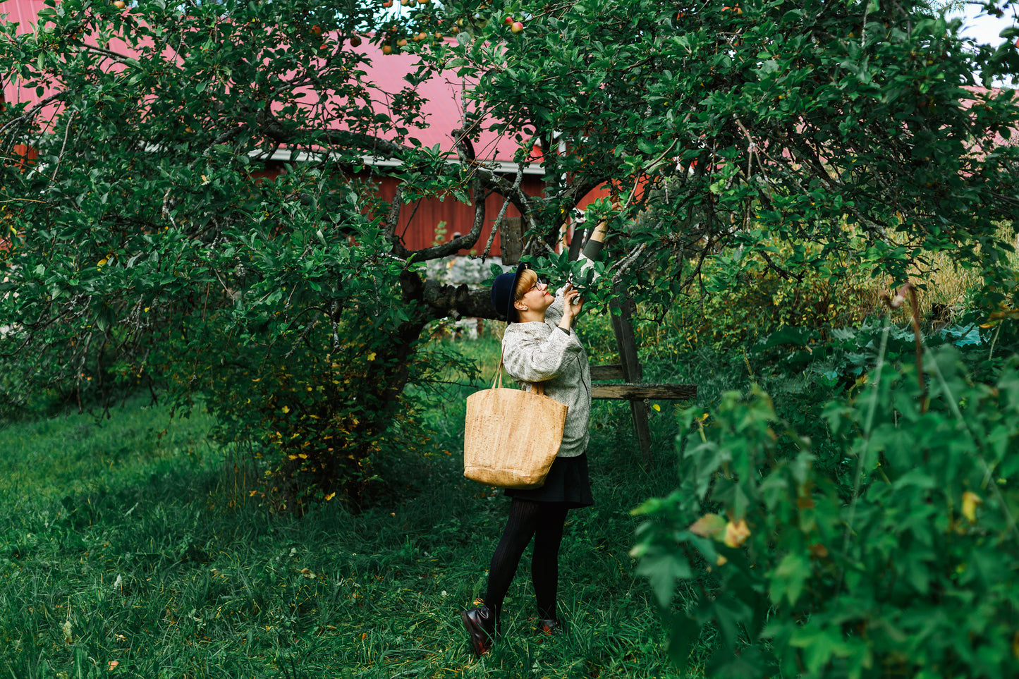 Aura bags handles are long enough to carry the bag on your shoulder and short enough the bag does not reach the ground while carrying it on straight hand (165cm lady carrying the bag).